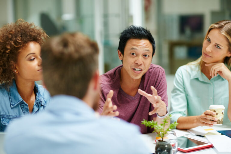 man speaking up in a meeting