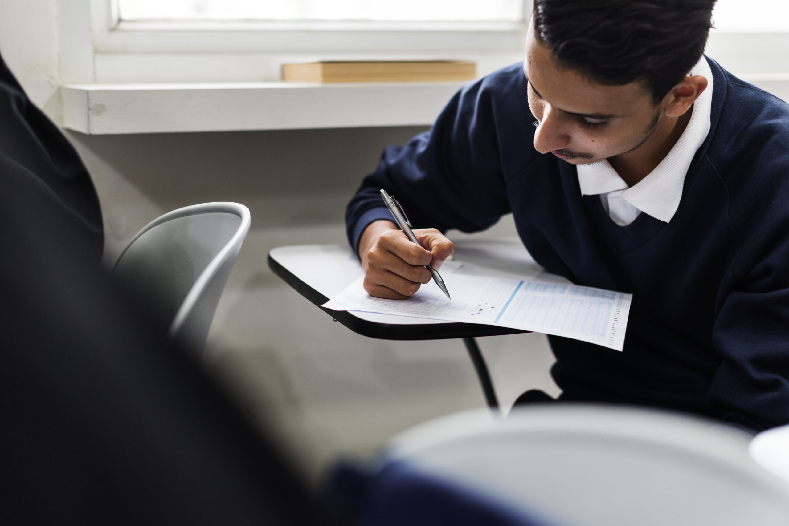 student taking a school exam