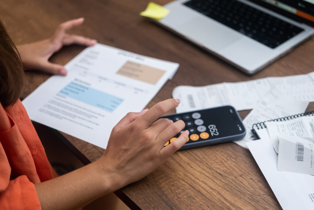 woman looking at bills