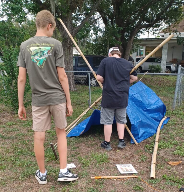 Teens learning bushcraft survival skills outdoors at Lakeland Highlands Scrub in Bartow, FL