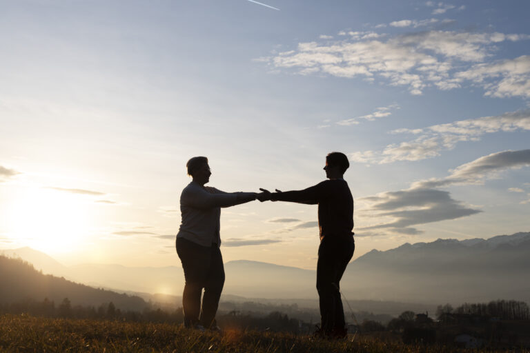 A hand reaching out to help another, symbolizing servant leadership rooted in humility and service