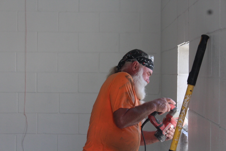 Crews work on the interior of the building where offices, storage, and mechanical will be held.