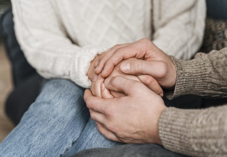 Two people in a comforting conversation, symbolizing healing shared with others through faith