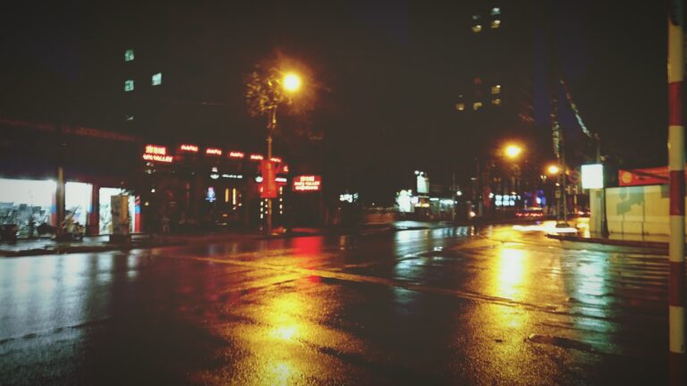 A car stalled at a gas station at night, symbolizing an unexpected delay that became protection