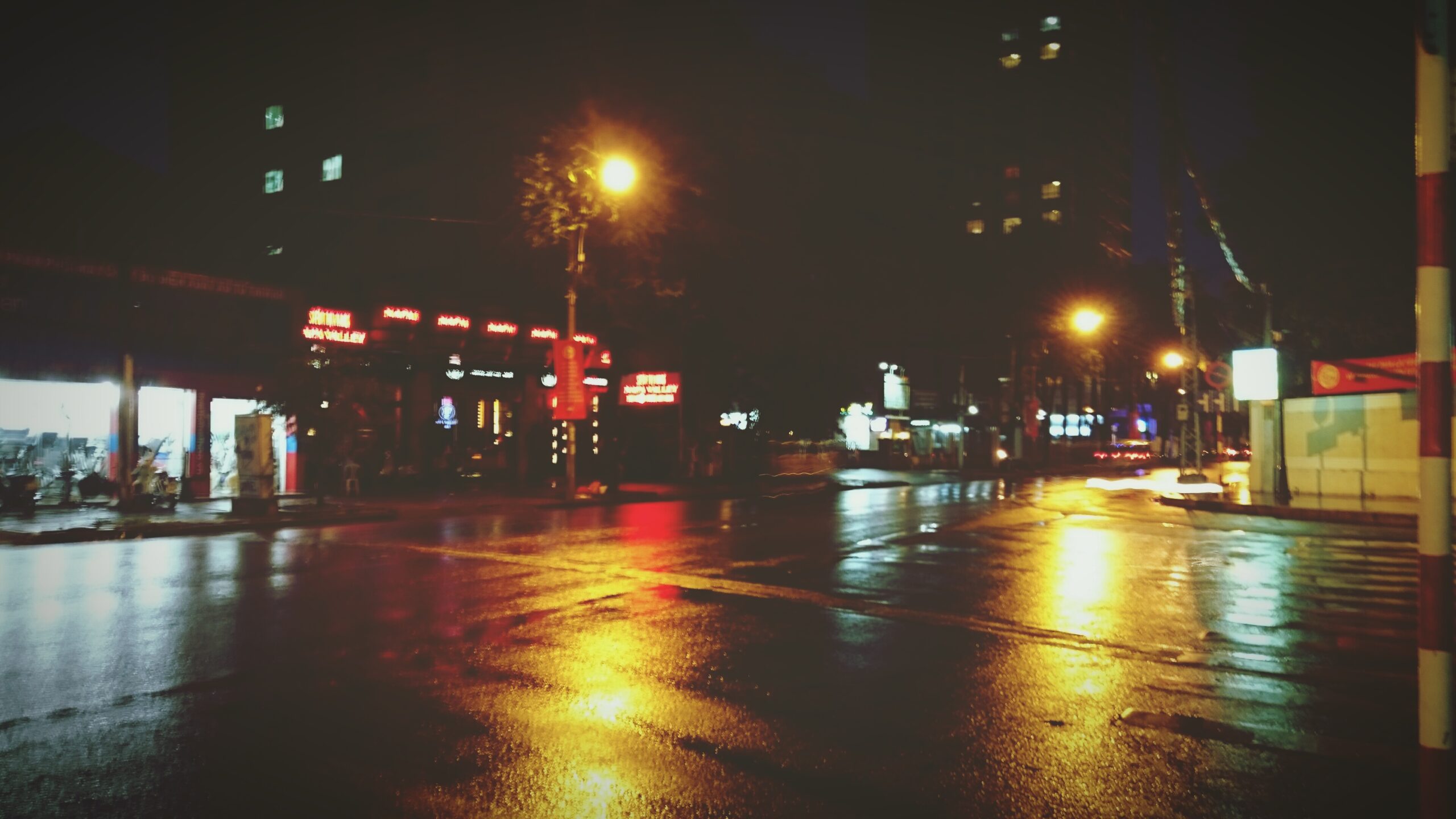 A car stalled at a gas station at night, symbolizing an unexpected delay that became protection