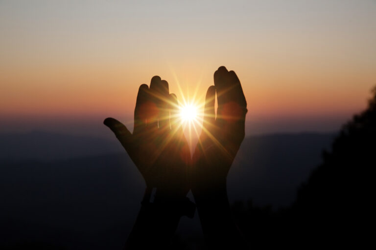hands in quiet prayer, symbolizing receiving God's forgiveness