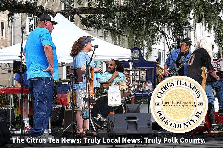 Members of the Mark Griffin Band, all of whom hail from throughout Polk County, tune up their instruments prior to the opening of their performance.