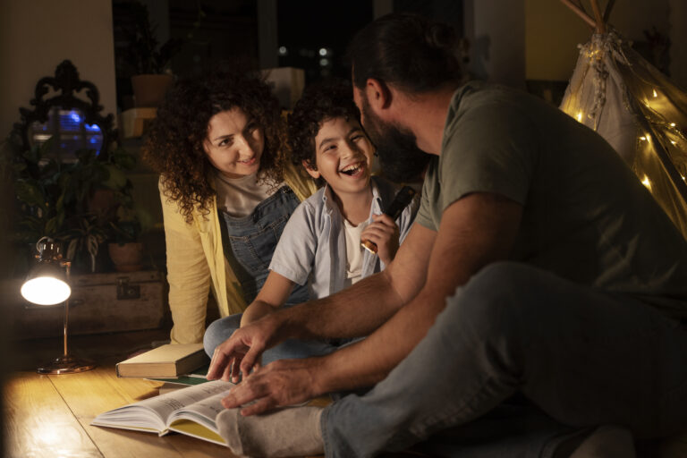 A family home glowing with warm light at dusk.