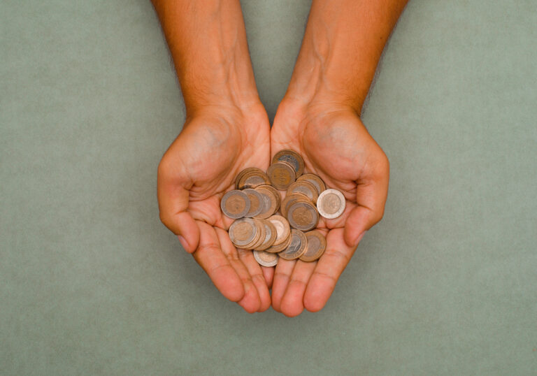 gold coins resting in an open hand