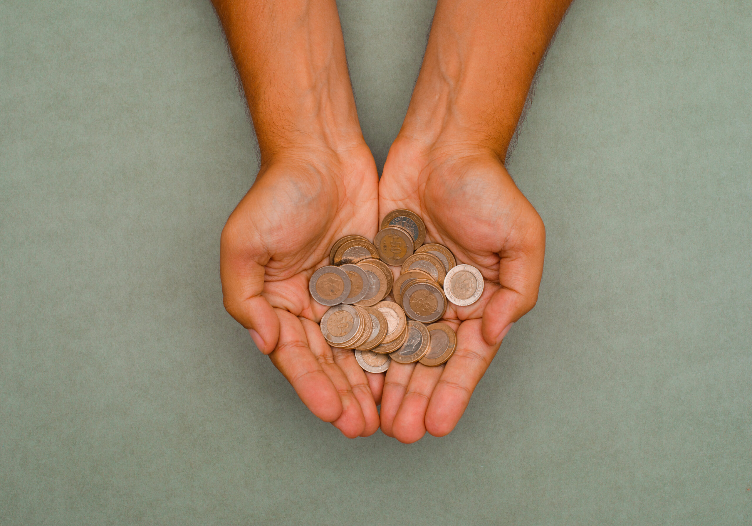gold coins resting in an open hand